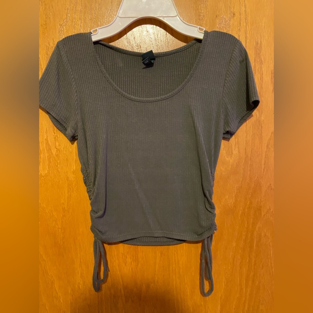 Green cropped tee shirt with draw strings at the side